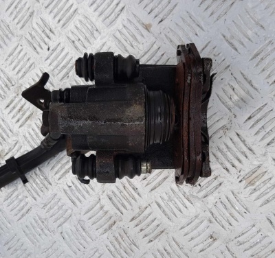 Суппорт тормозной задний левый Ford Escape 2000-2012 6L8Z 2553 A